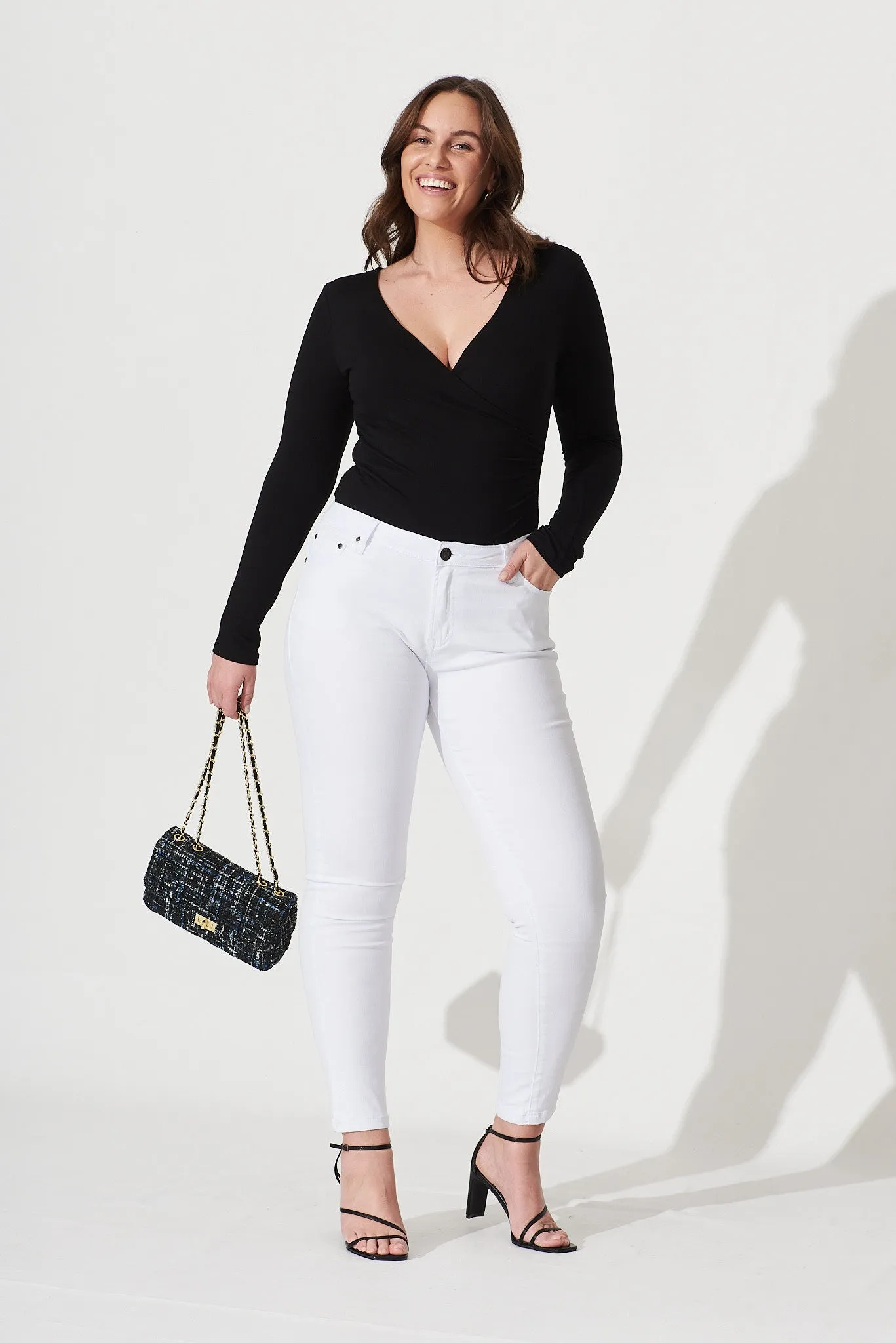 Brooklyn Mid Rise Jeans In White Denim